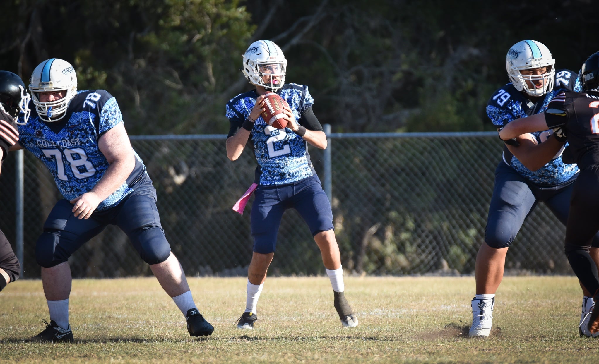 Why do American football players tape their cleats?